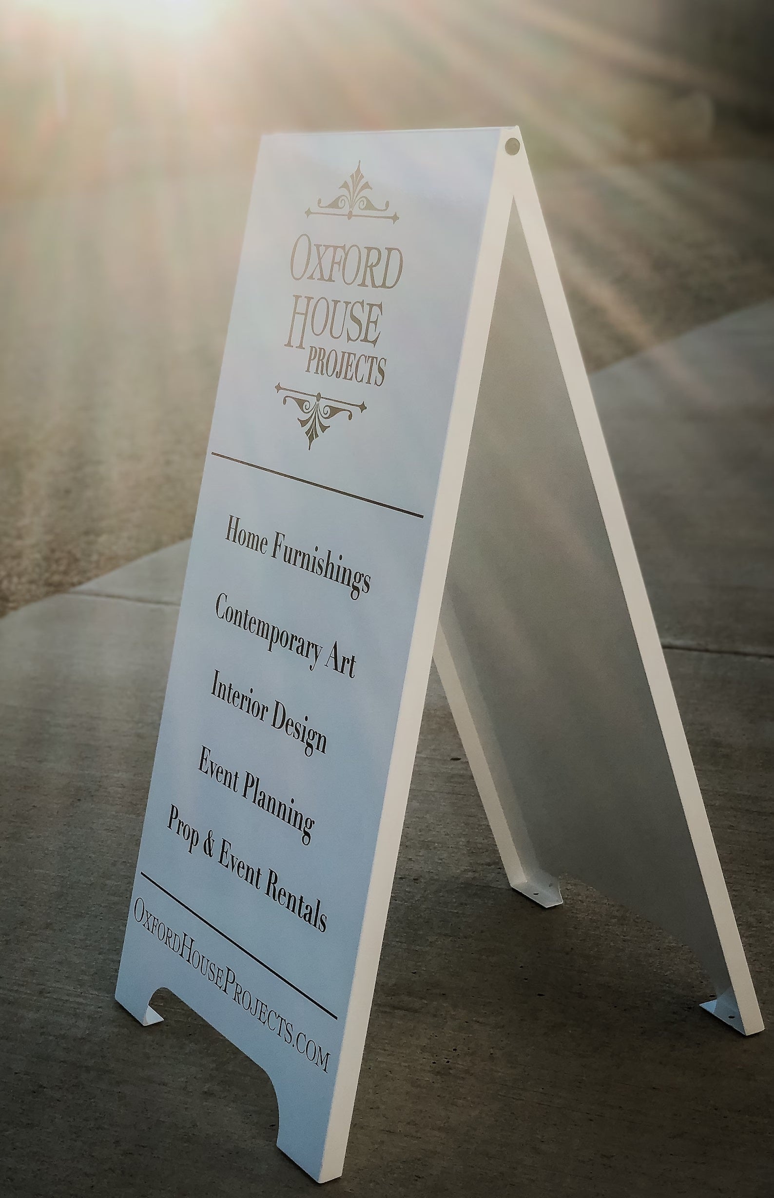 Custom sandwhich board sidewalk sign made of white metal and black text