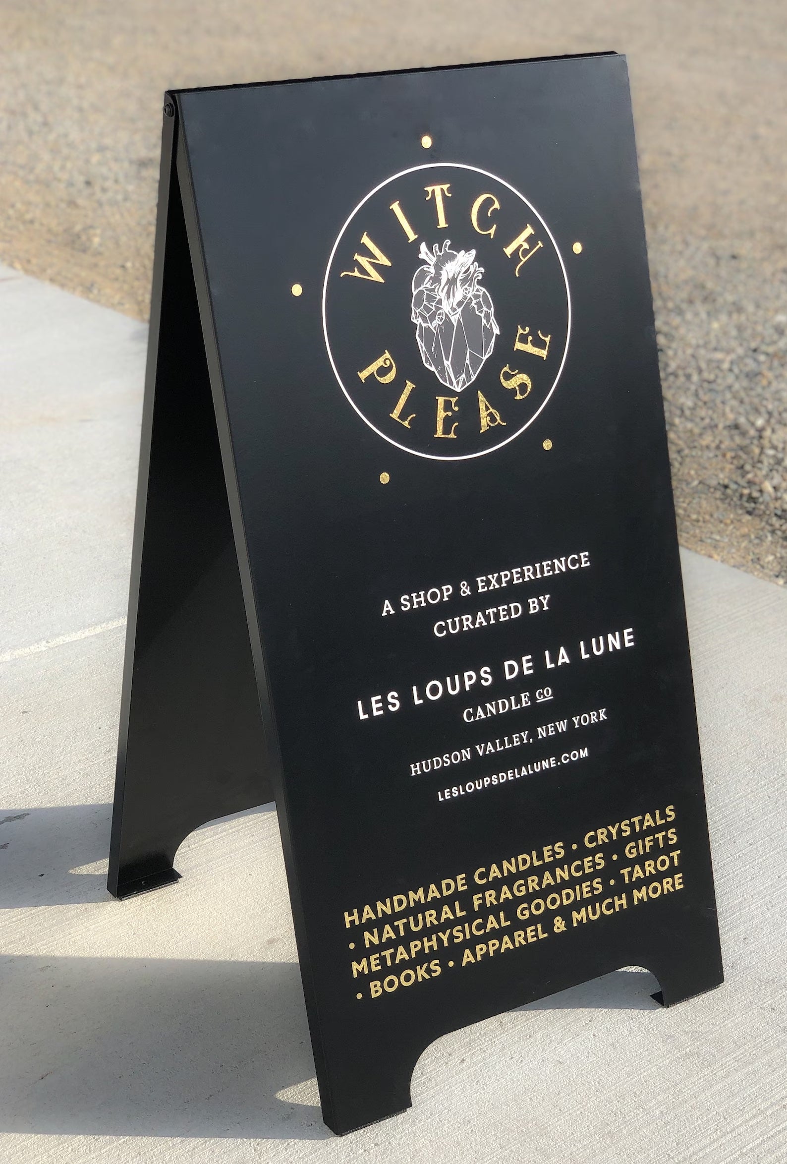 Custom business sidewalk sign in black with gold and white lettering